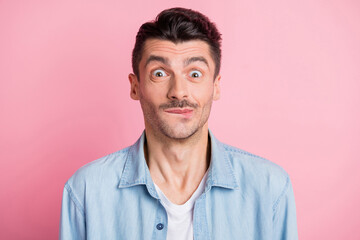 Photo of excited happy young attractive man amazed wish anticipation isolated on pastel pink color...