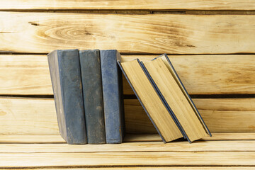 Old books in blue hardcover close-up. Background from books.