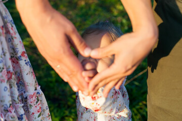 Portrait of a happy family in the park-an outdoor photo. Family photo shoot