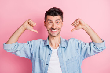 Photo of charming handsome young happy man point fingers himself me isolated on pastel pink color background