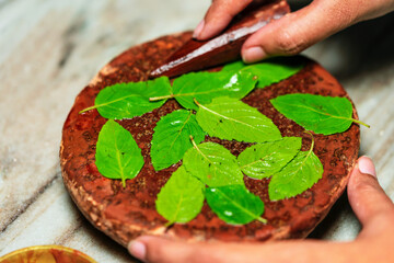 Hindu Religious Ritual. Hindu Puja ritual preparation background. Closeup of sandalwood stick or...
