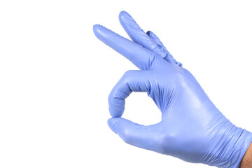 Hand in blue glove isolated on white showing ok sign.