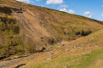 Walking at the Gunnerside Gill towards the Bunton Mine, North Yorkshire, England, UK
