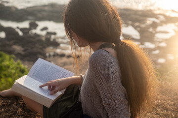 One asian woman and a book with sea view