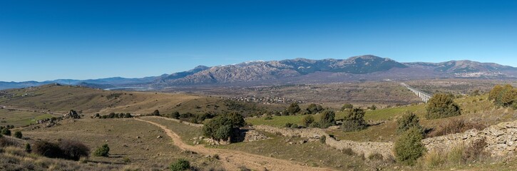 Fototapeta na wymiar Panoramic views of Guadarrama Mountains from the Saint Peter Peak, in the municipality of Colmenar Viejo, Madrid, Spain