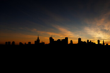 Warsaw Skyline Silhouette At Sunset In Poland