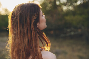 attractive woman outdoors in the garden sunset fresh air trees