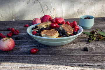 homemade pancakes with apples, blackberries and dogwood