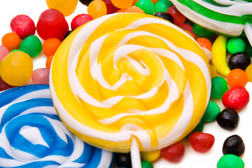 spiral colored lollipops and candy assortment isolated