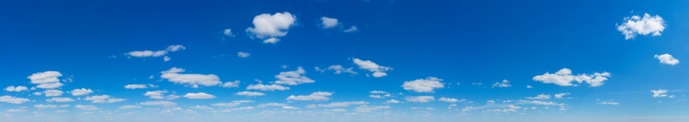 Obraz premium Blue Sky background with tiny Clouds. Panorama background