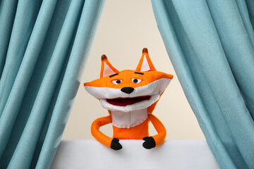 Creative puppet show on white stage indoors