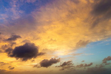 Naklejka na ściany i meble Colorful sunset sky over tranquil sea surface