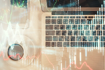 Obraz premium Stock market chart and top view computer on the table background. Multi exposure. Concept of financial analysis.