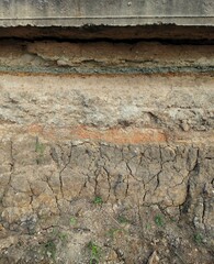 Red soil layer caused by soil subsidence  In the rainy season