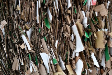 Large blocks of waste paper cutting. Recycling of shredded wastepaper reduces the need for deforestation for the production of various types of paper and cardboard.