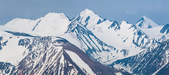 Fototapeta premium Panoramic mountain view. Snow-capped peaks and glaciers.