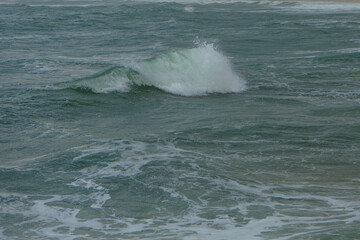 Big wave with sea foam and bright Turquoise  water