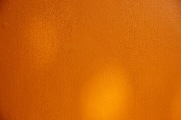 Naklejka premium Gold or yellow paint on cement wall texture background.