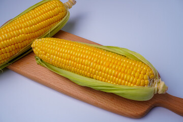 Fresh corn or maize isolated in white background