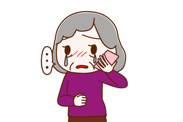 スマホで涙を流しながら悲しそうに話す高齢の女性