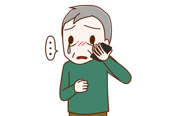 スマホで涙を流しながら悲しそうに話す高齢の男性