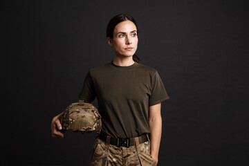 Confident young military woman wearing comouflage