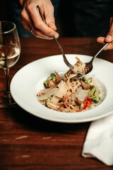 Italian pasta with vegetables and cheese in the restaurant