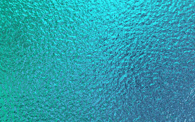 Teal green blue foil paper texture background.