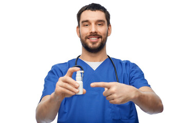 healthcare, profession and medicine concept - happy smiling doctor or male nurse in blue uniform with oral spray and stethoscope over white background