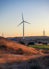 Sunset view of wind power plant. Vast turbine wind mills farm at jhimpir