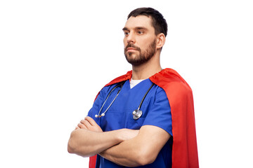 healthcare, profession and medicine concept - doctor or male nurse in blue uniform and red superhero cape with stethoscope over white background