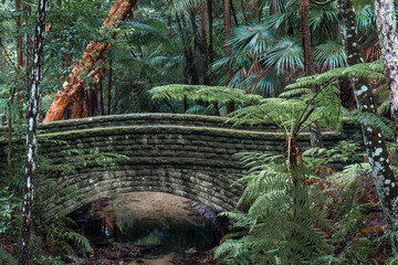 Fototapeta premium Close-up view of old bridge covered by moss.