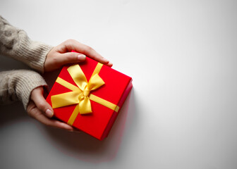 hands hold a gift on a white background