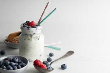 Portion of flax seeds in a small bowl. Healthy super foods flax seeds in a bowl mixed with yoghurt ready to eat. These seed are very healthy and can be eaten with a variety of different dishes.