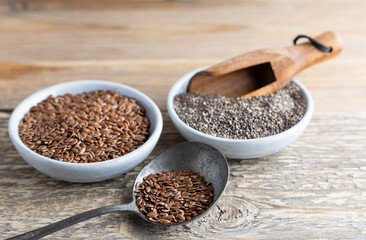 Portion of flax and chia seeds in a small bowl. Healthy super foods Chia and flax seeds in a bowl ready to eat. These seed are very healthy and can be eaten with a variety of different dishes.