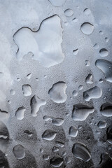 Close up view of water rain drops on a metal surface	