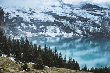 Lake Oeschinensee in autumn with first snow