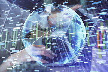 Double exposure of woman hands typing on computer and business theme hologram drawing. Success concept.