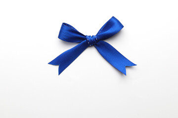 Blue ribbon bows isolated on white, top view image.