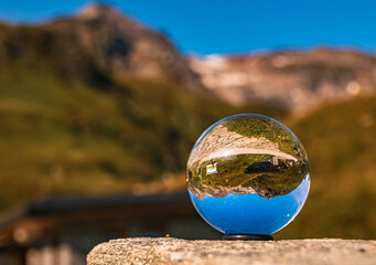 Crystal ball alpine summer landscape shot at the famous Kaprun high mountain reservoirs, Salzburg, Austria