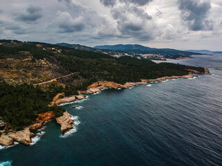Fototapeta na wymiar Aerial view over western Alonnisos island and the rock formation. Natural landscape, beautiful Greek scenery, spectacular view in Sporades, Aegean sea, Greece