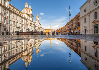Fototapeta na wymiar Rome, Italy - in Winter time, frequent rain showers create pools in which the wonderful Old Town of Rome reflect like in a mirror. Here in particular Piazza Navona