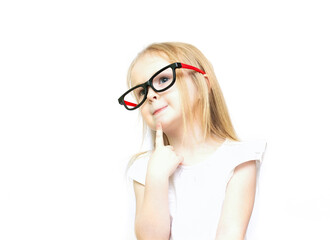 Little girl in glasses is thinking