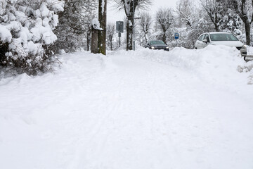 Snowfall in the city. Pedestrian sidewalks and traffic