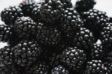 Close-up of shiny, freshly picked blackberries. Berry background