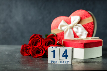 Valentines day concept with red roses and cube calendar. 14 of february, celebration day