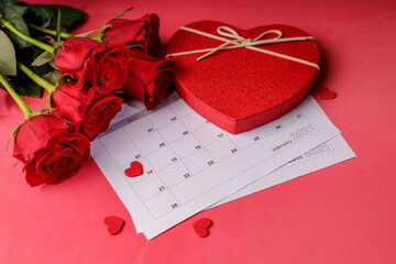 Valentine day. Red hearths and roses on Calendar page. February 14 of Saint Valentines day. Pink...