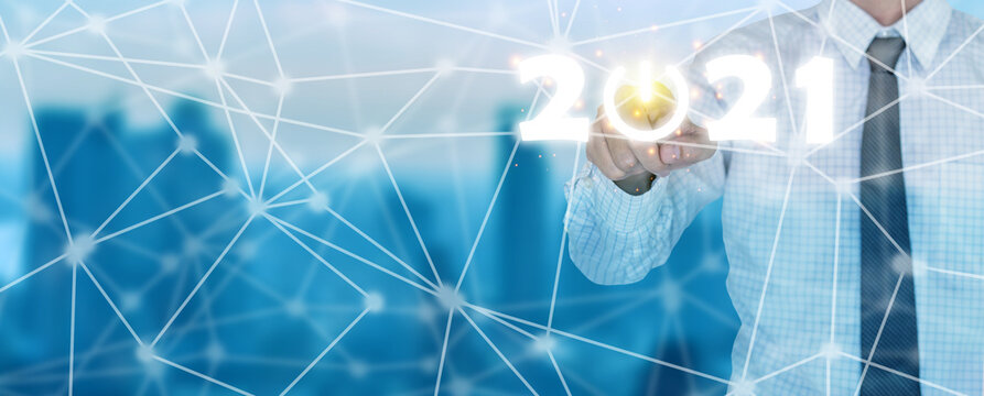2021 new year and network concept, Businessman pressing 2021 start up business flat icon over city blue background, finance business digital technology ideas, New Year Beginning