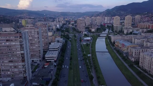 the aerial footage of traffic roads high-rise buildings and a river in Sarajevo, Bosnia