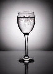 silhouette of transparent  glass  on red background